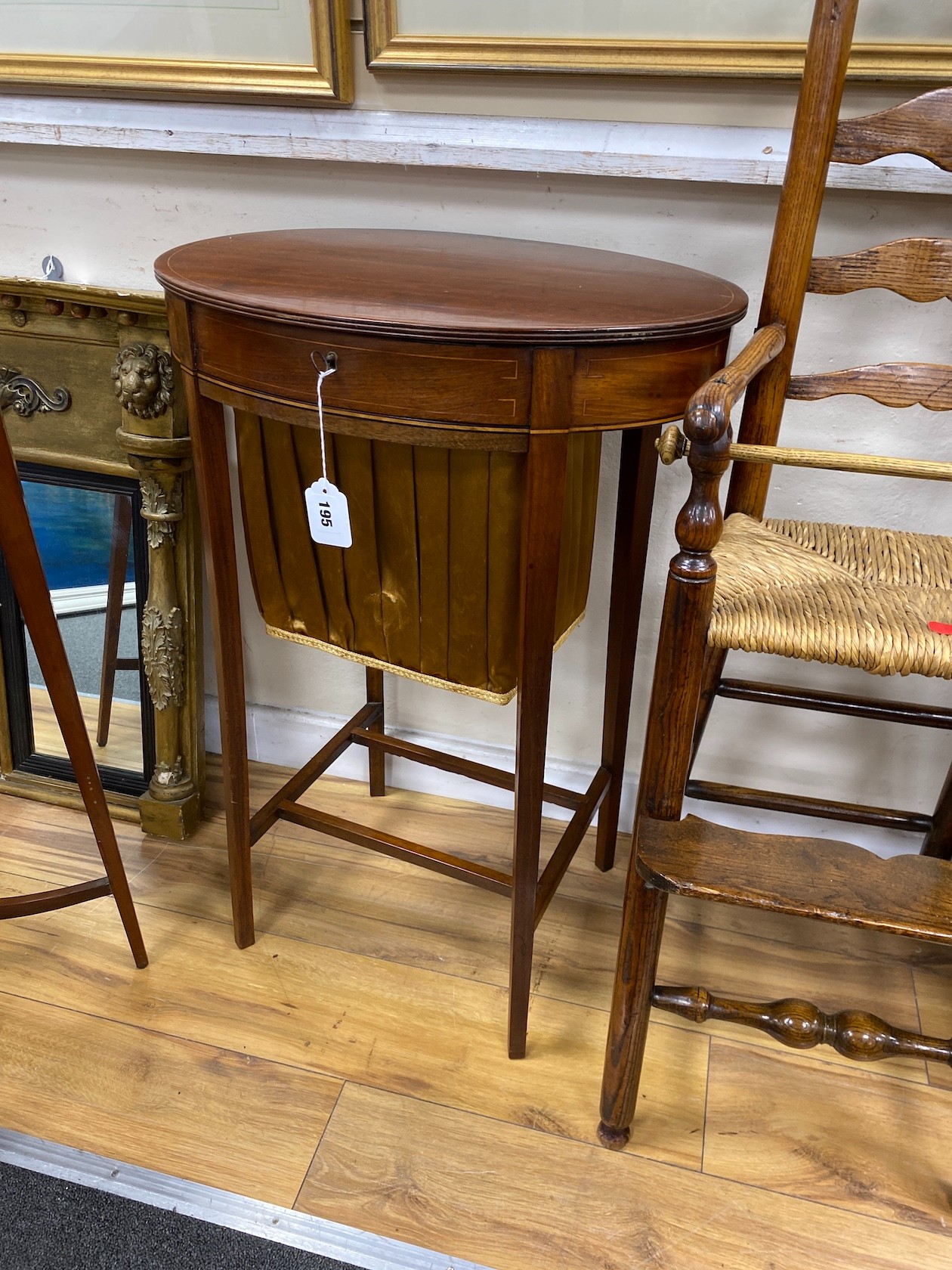 An Edwardian oval mahogany work table, width 52cm, depth 38cm, height 78cm